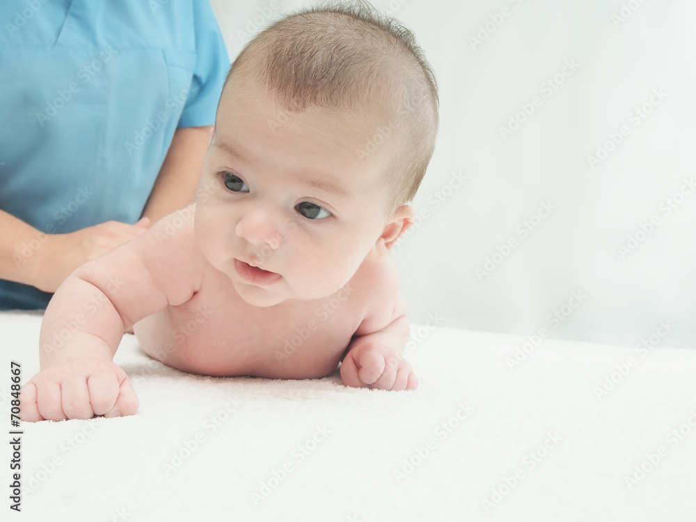 Doctor massage small caucasian baby Doctor massage small caucasian baby