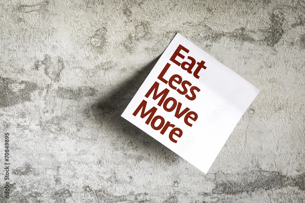 Eat Less Move More on Paper Note with texture background Eat Less Move More on Paper Note with texture background