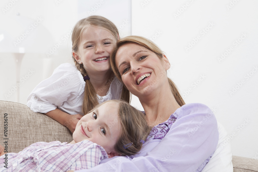 Germany, Munich, Mother with daughters smiling, portrait Germany, Munich, Mother with daughters smiling, portrait