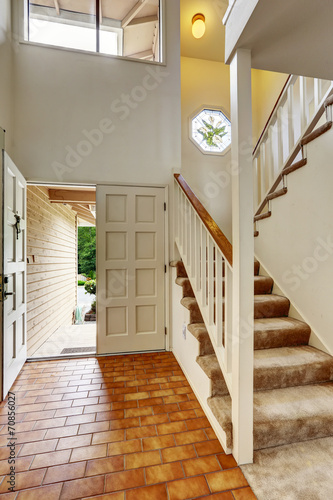 Empy house interior. Enrance hallway with staircase