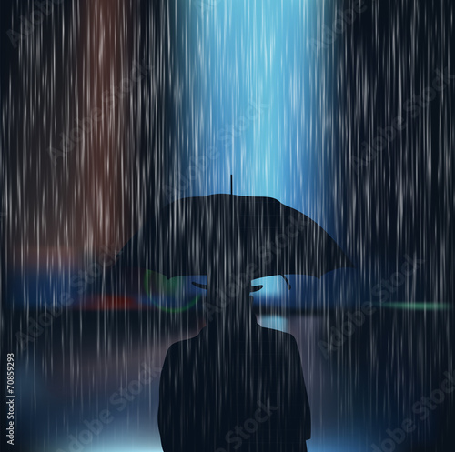 A man with an umbrella during a storm
