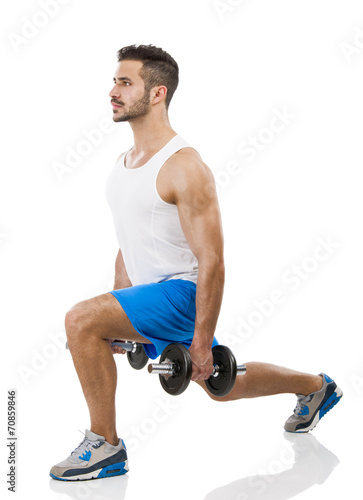 Athletic man lifting weights