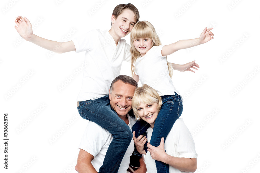 Playful family of four isolated over white Playful family of four isolated over white