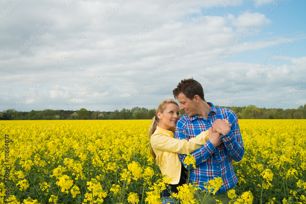 happy couple in rape field happy couple in rape field