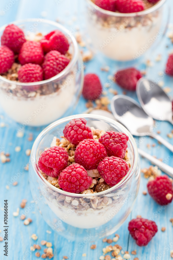 Yogurt with muesli and fresh raspberries Yogurt with muesli and fresh raspberries