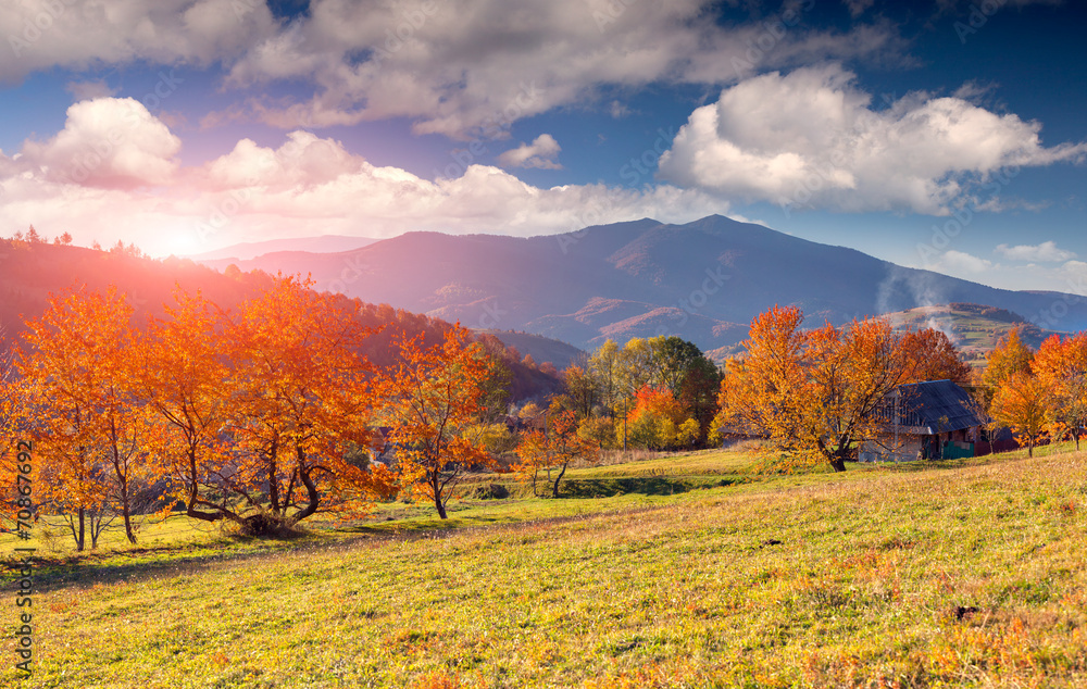 Colorful autumn landscape in the mountain village.