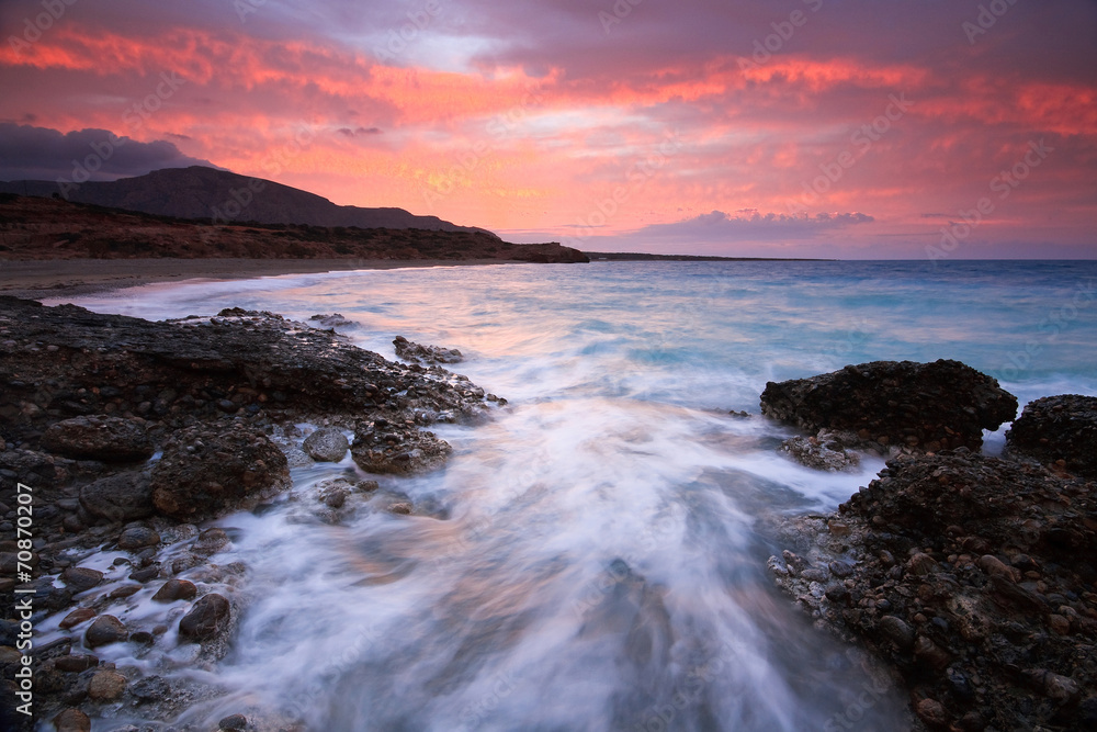 Winter sunset over a rough sea in Crete, Greece.