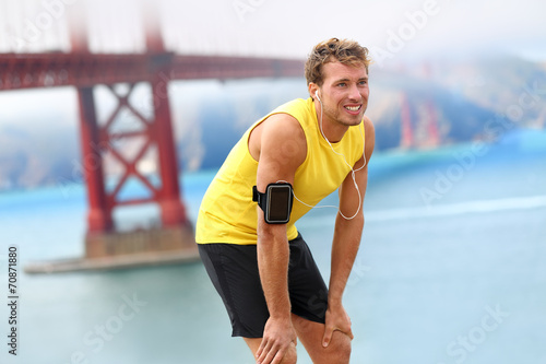 Fototapeta Naklejka Na Ścianę i Meble -  Running man - male runner resting in San Francisco