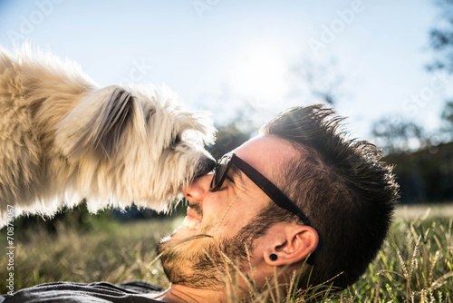 Boy play with his dog photo
