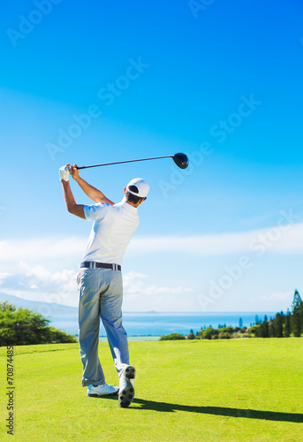 Man Playing Golf, Hitting Ball from the Tee