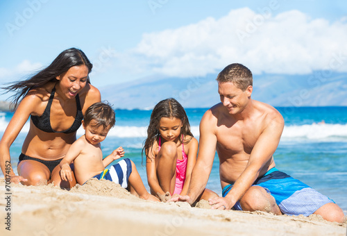 Family Playing on the Beach © EpicStockMedia
