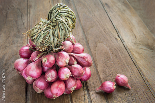 Bunch of shallot on wooden background