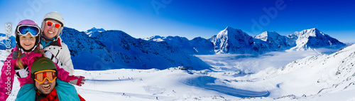 Ski, skier, panorama - family enjoying winter vacations