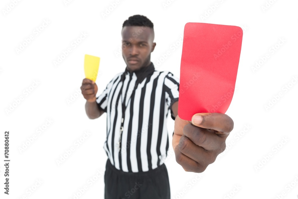 Serious referee showing yellow and red card Serious referee showing yellow and red card
