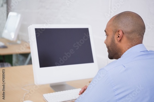 Businessman using computer at office