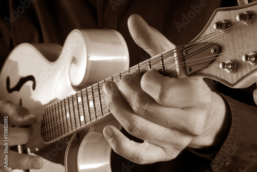 playing mandolin,sepia image photo