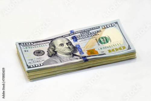 one hundred dollar bill closeup on white background