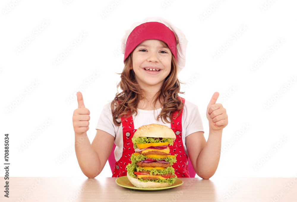 happy little girl cook with big hamburger and thumbs up happy little girl cook with big hamburger and thumbs up