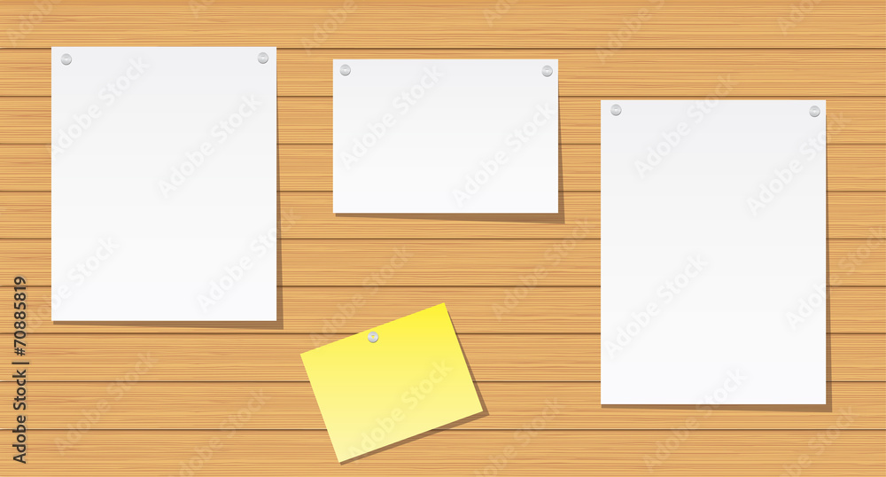 Sheets of paper on a wooden wall Sheets of paper on a wooden wall
