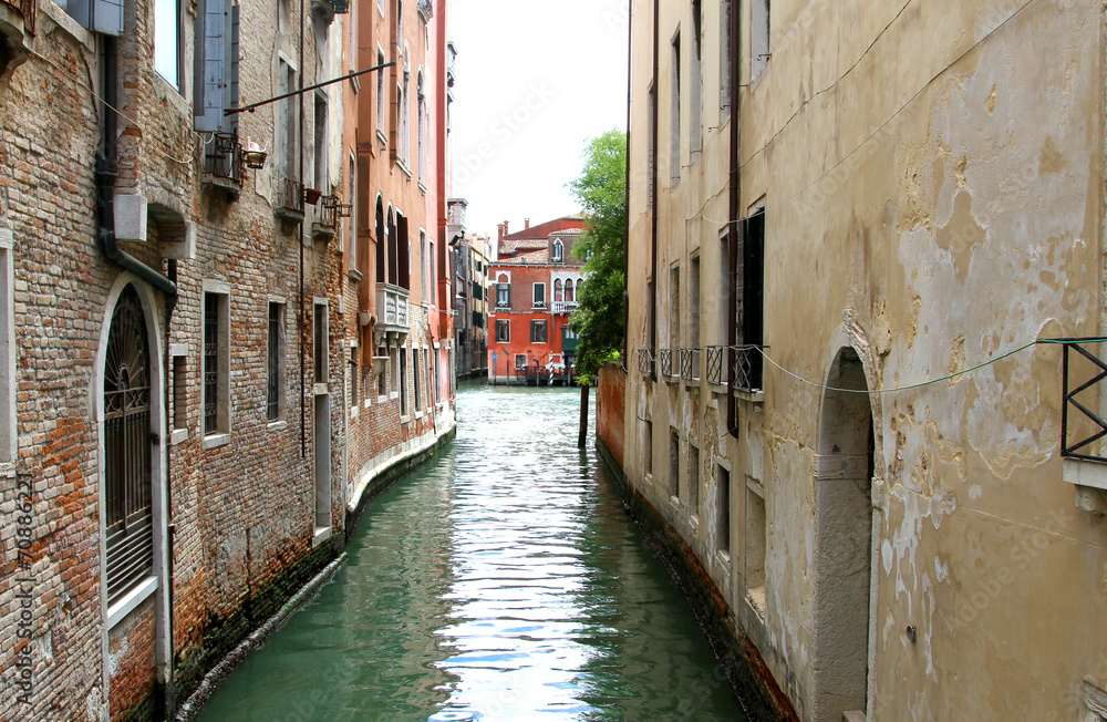 narrow navigable canal in Venice in Italy
