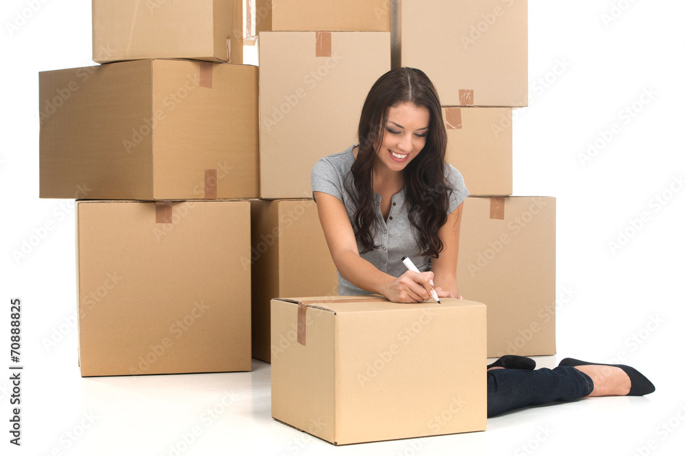mid adult happy woman during move with boxes at new flat. mid adult happy woman during move with boxes at new flat.