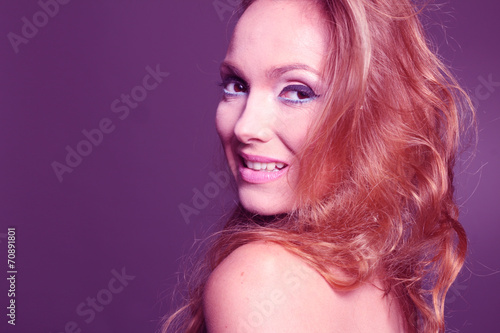 Beautiful redhead woman smiling at the studio