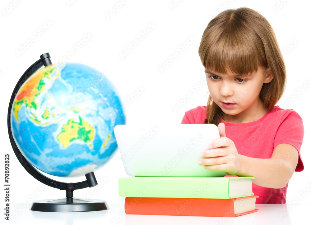 Young girl is using tablet