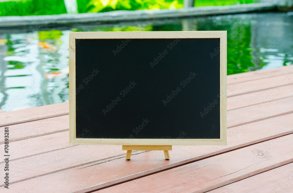 Black board on wood floo
