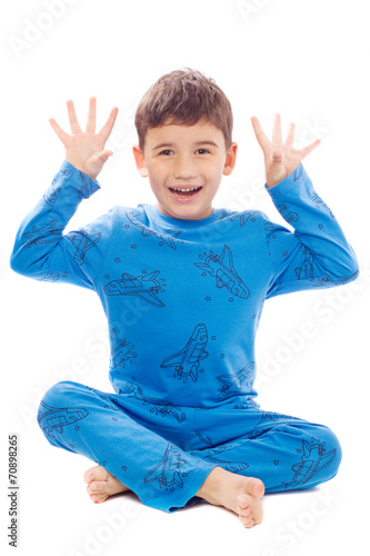 Картината върху платно Naughty boy in pajamas on white background