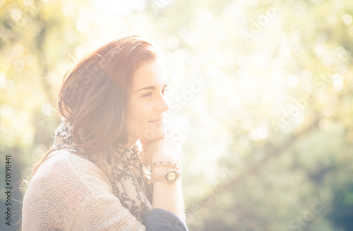 Fototapeta Naklejka Na Ścianę i Meble -  Young woman outdoor portrait, soft sunny daylight