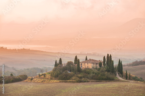 Tuscany landscape in the mist at sunrise
