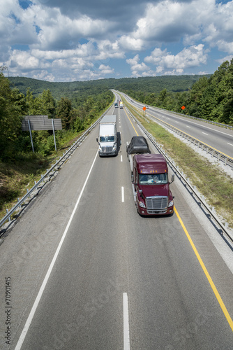 Semi-Trucks Travel Down The Interstate