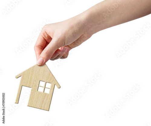 Hand holding wood home