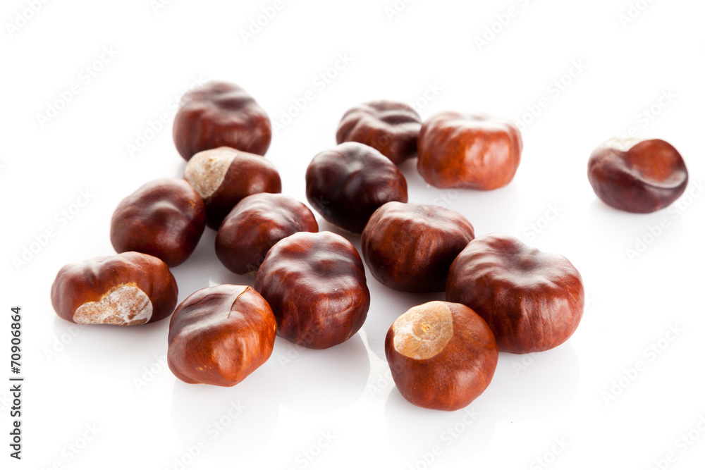 Chestnut on white background. ripe chestnuts Chestnut on white background. ripe chestnuts