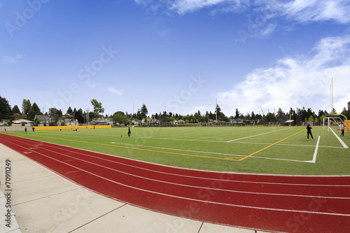 Football field and running rack. School sport yard