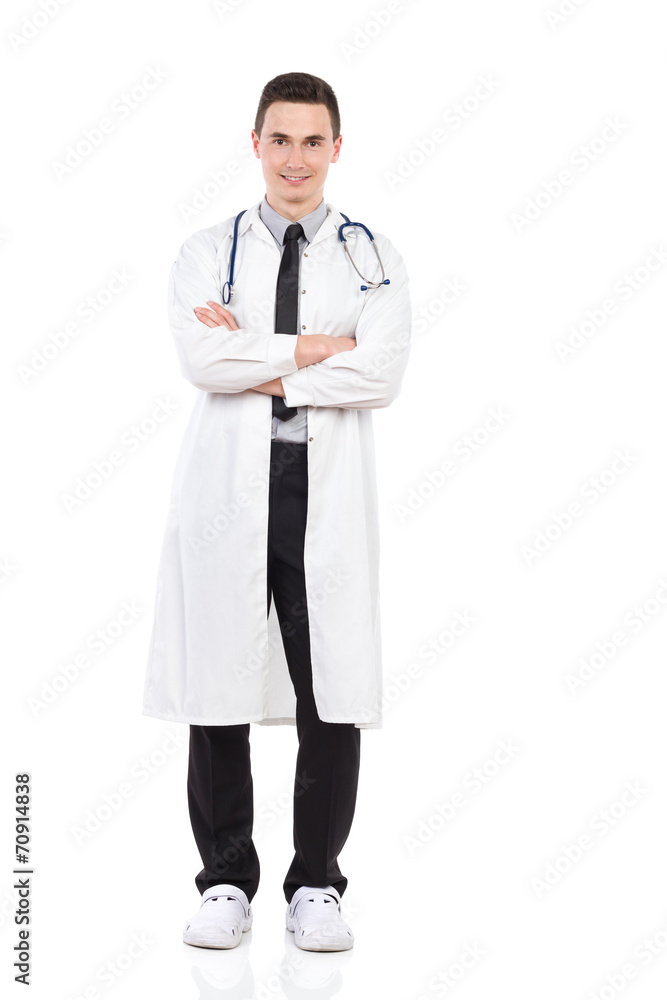 Smiling male doctor posing with arms crossed Smiling male doctor posing with arms crossed