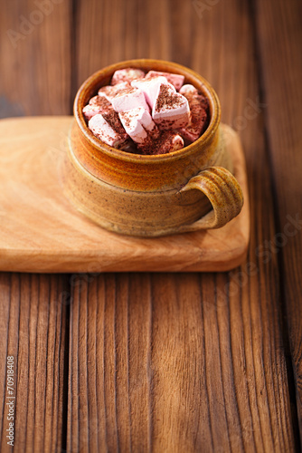 hot chocolat vintage mug, topping with marshmallow on textured w