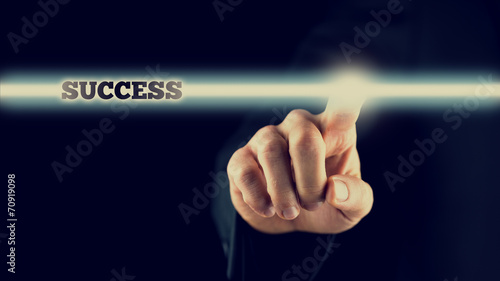 Man activating a bar with the word - Success