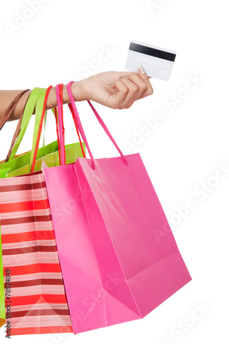 Woman with credit card and shopping bags