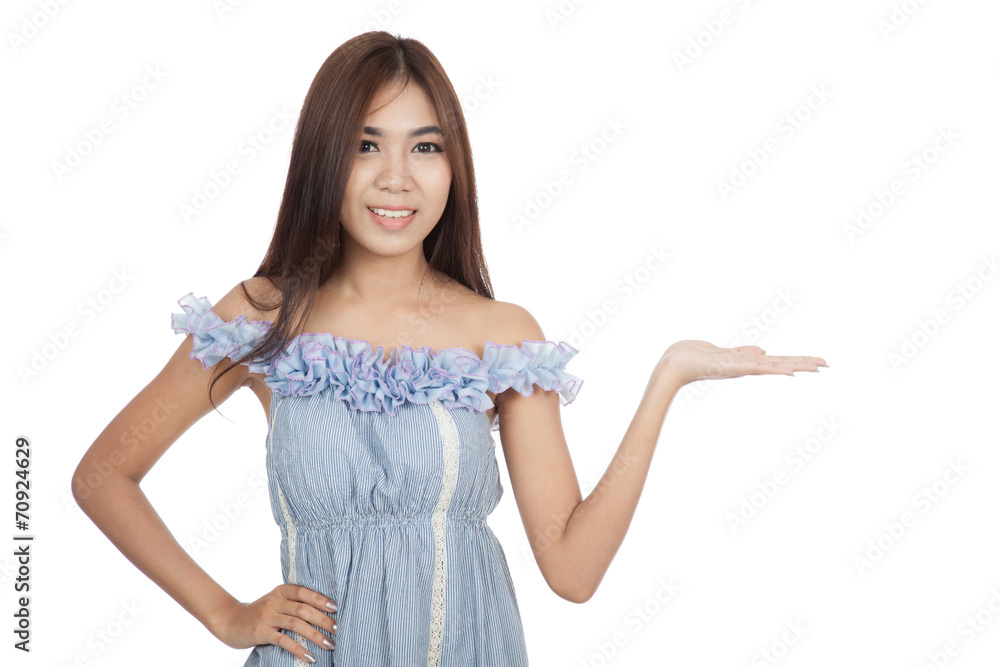 Beautiful Asian woman present something and smile Beautiful Asian woman present something and smile