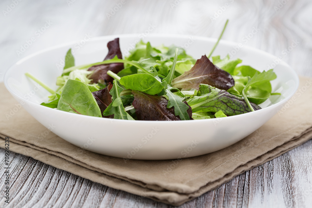 mesclun mix salad in white bowl