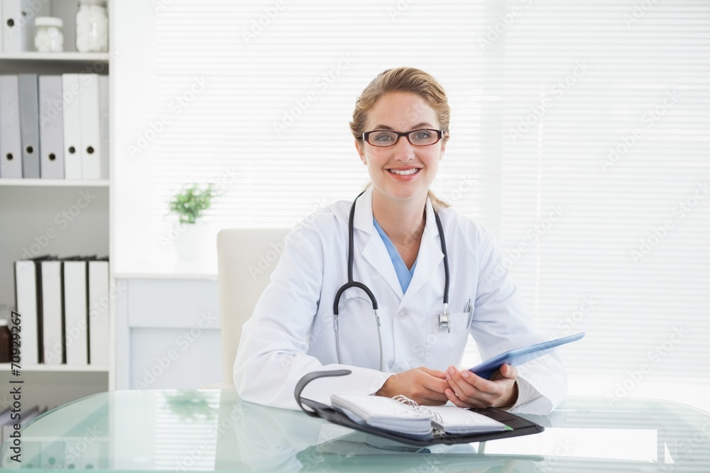 Doctor holding her tablet pc Doctor holding her tablet pc