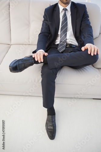 Businessman with leg on his knee © WavebreakmediaMicro