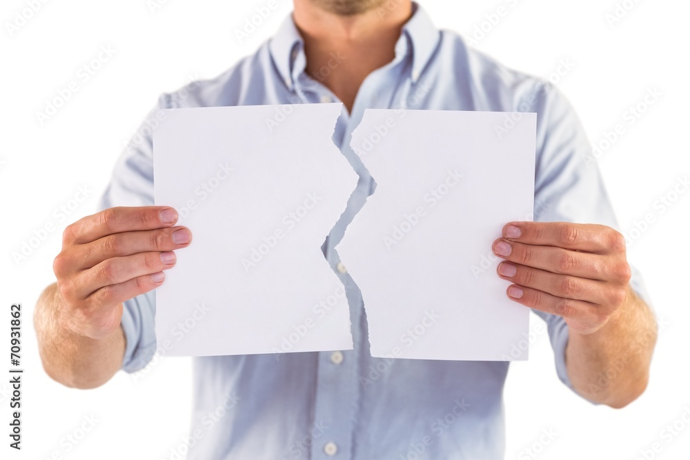 Man holding torn white paper Man holding torn white paper