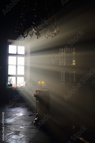 Altar and sunlight in window in dark eastern orthodox temple