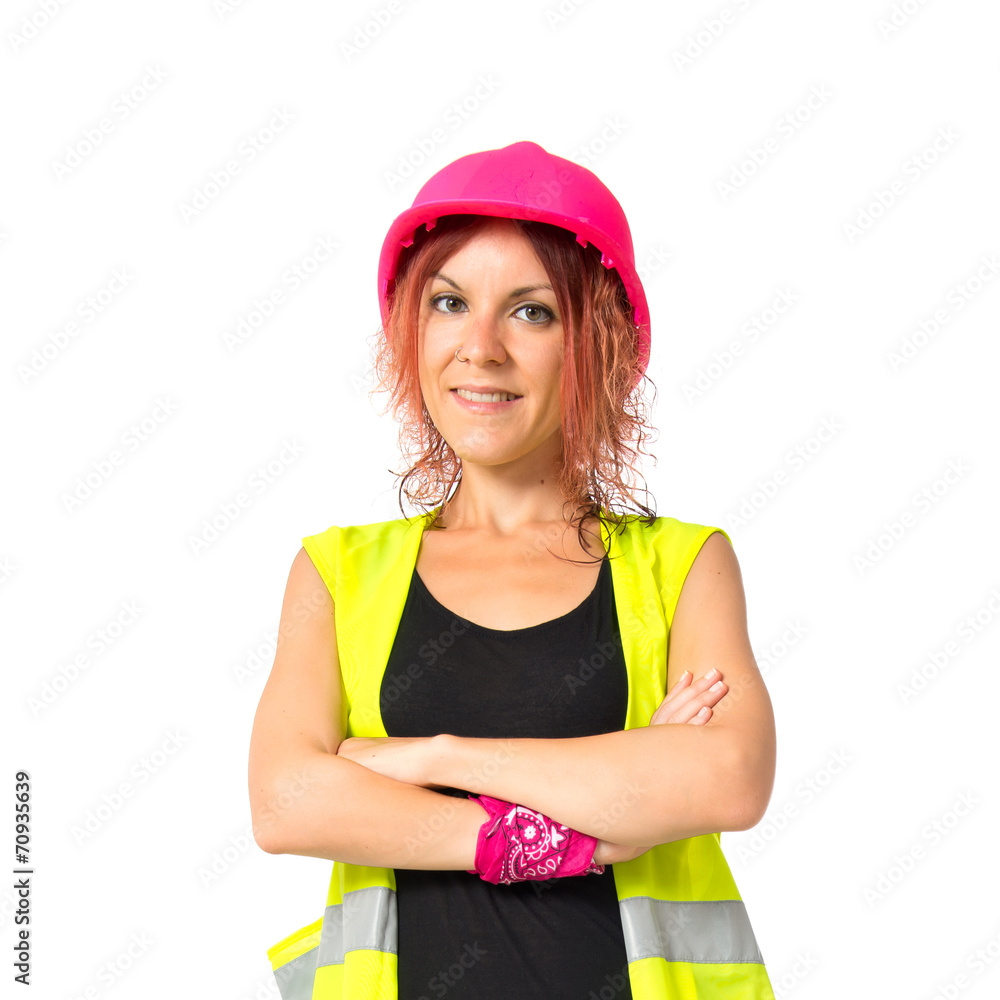 Woman worker with pink helmet over white background Woman worker with pink helmet over white background