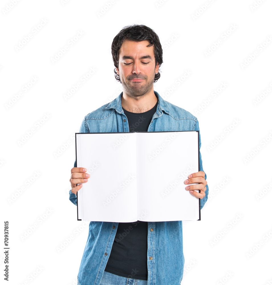 Man showing book over white background Man showing book over white background
