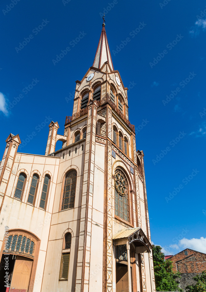 Old Brown Church and Steeple Under Blue Sky