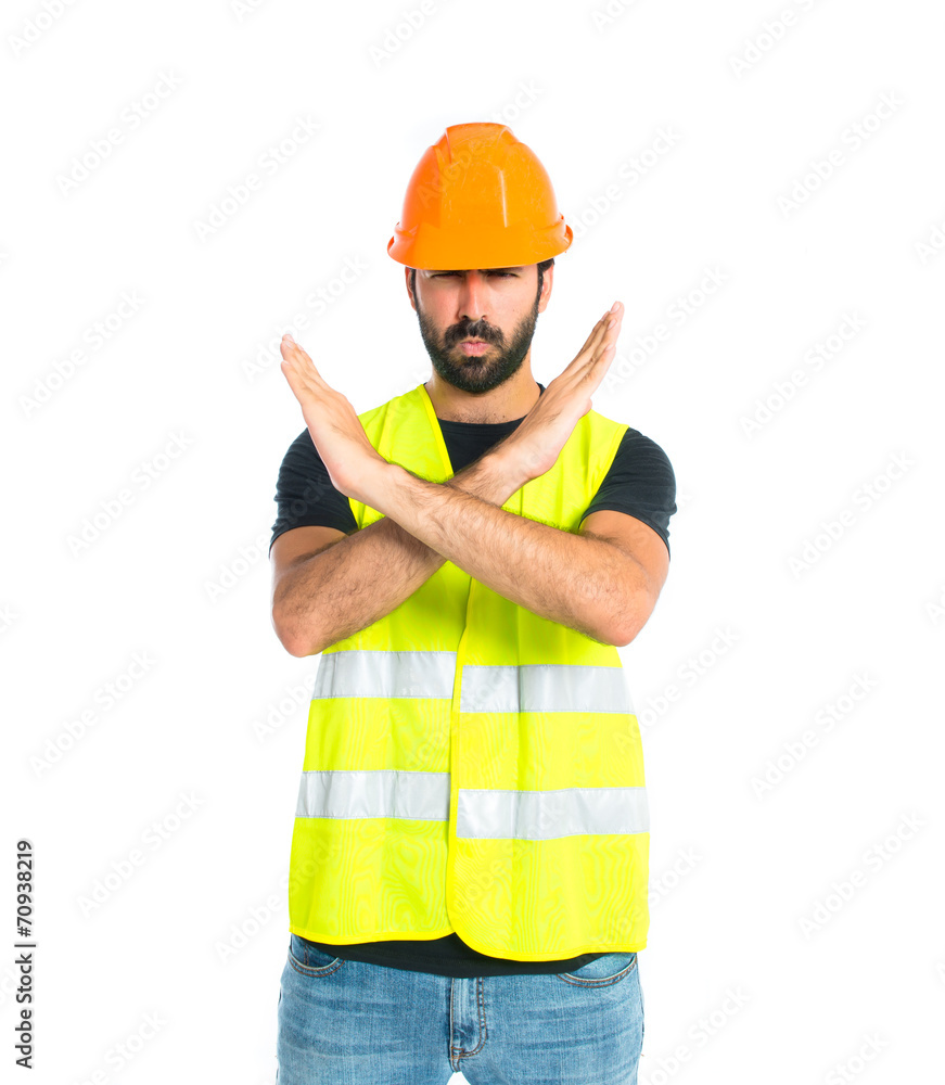 Workman making stop sign over white background Workman making stop sign over white background