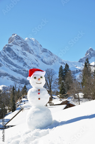 Snowman against Alpine panorama. Switzerland © HappyAlex